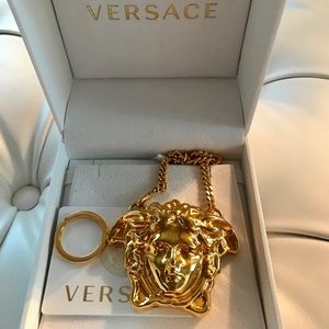 Versace Medusa head pants or key charm
